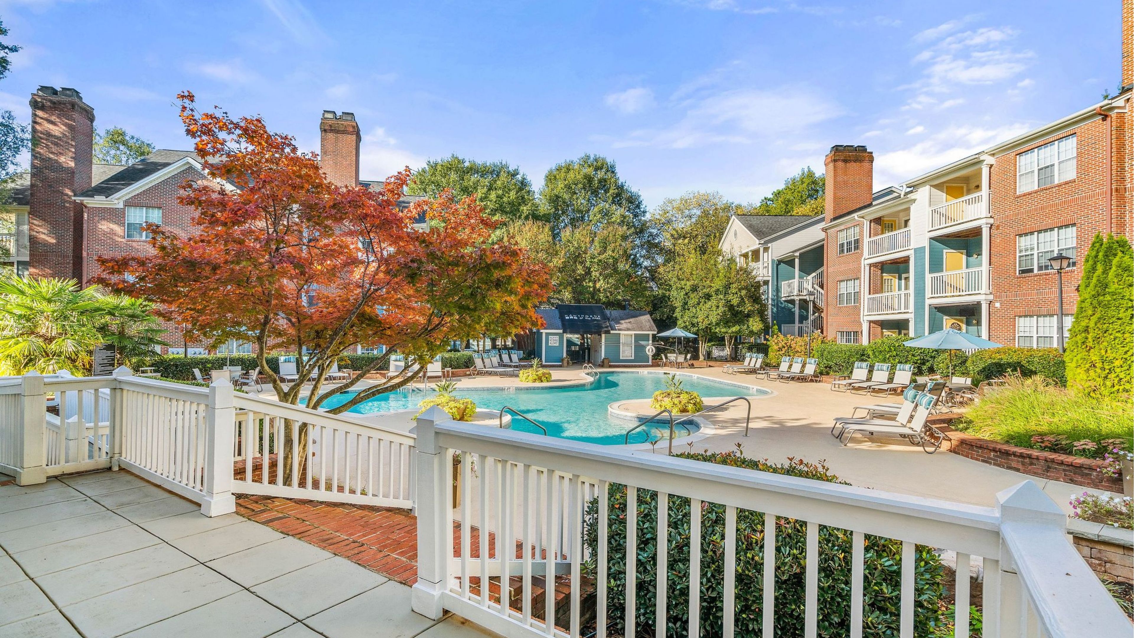 The Haywood clubhouse front porch looking out to the resident pool.