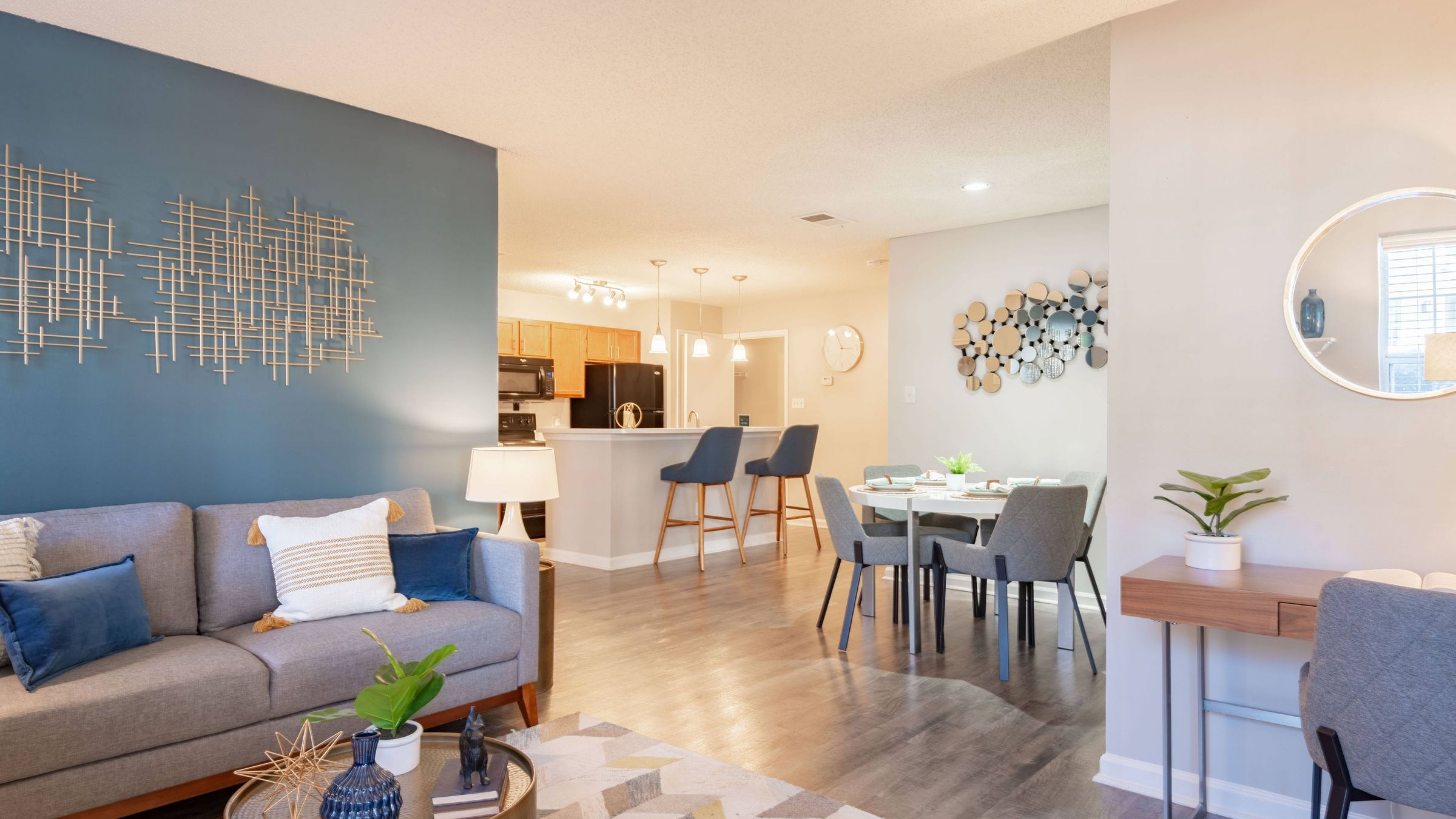 The Haywood apartment open floor plan living area with hardwood floor.