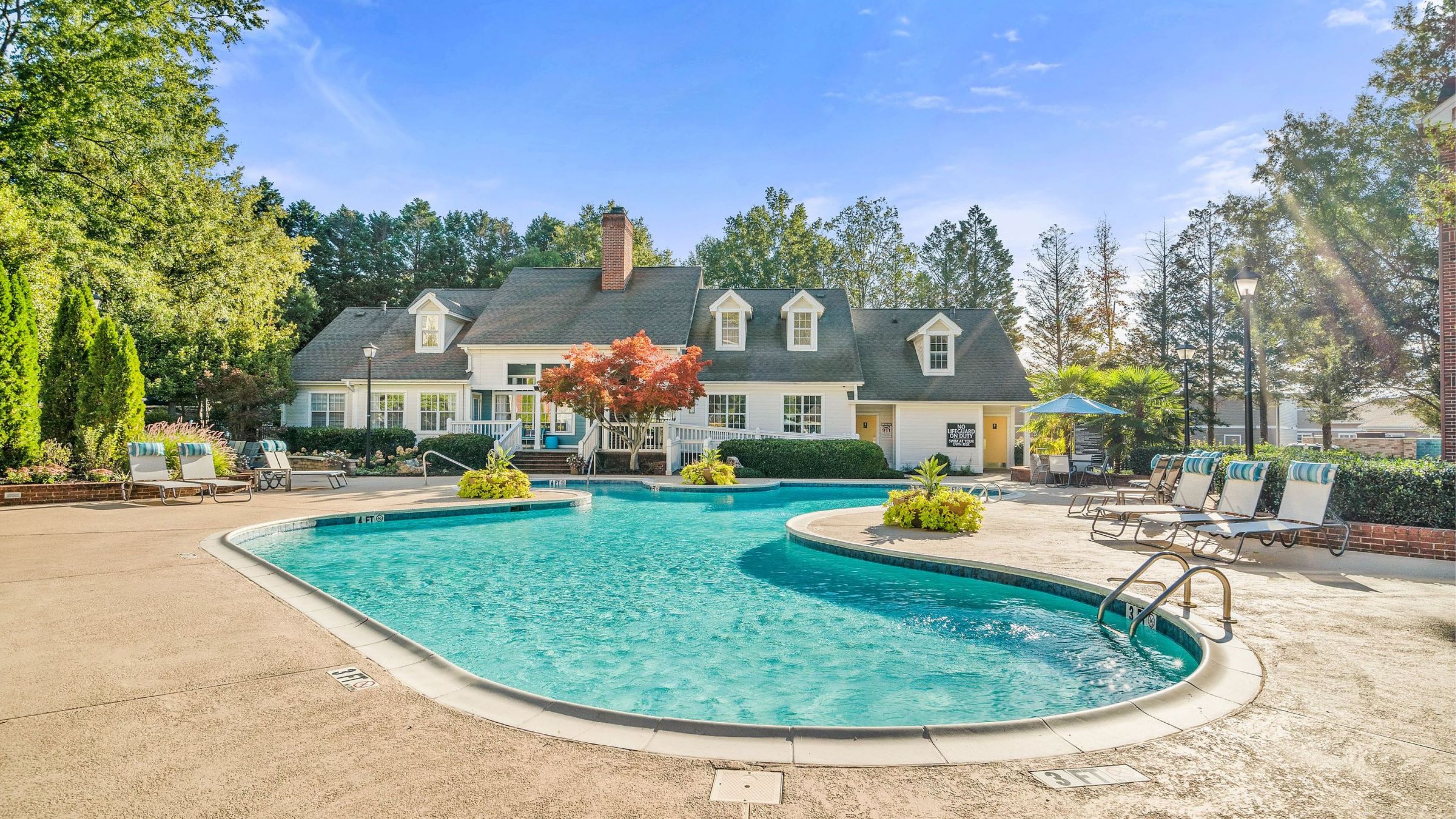 The Haywood resident pool amenity with lounge chairs.